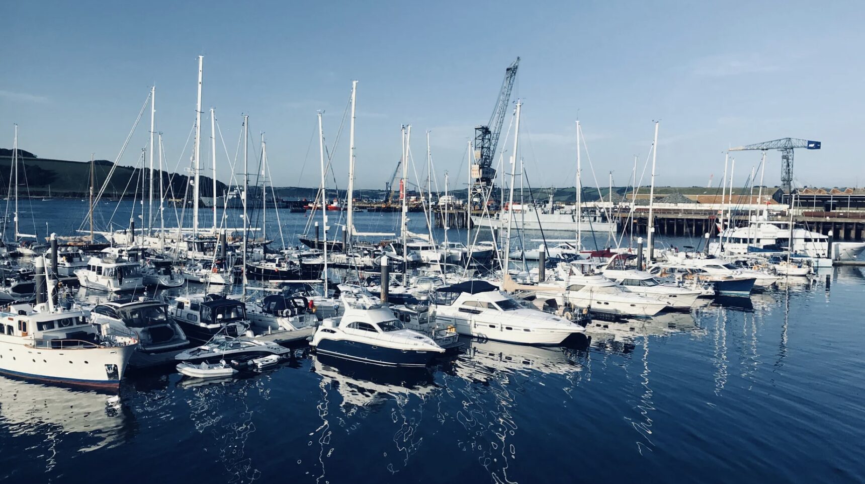 many boats are docked at a marina using Best Composting Toilet Airhead Toilet.