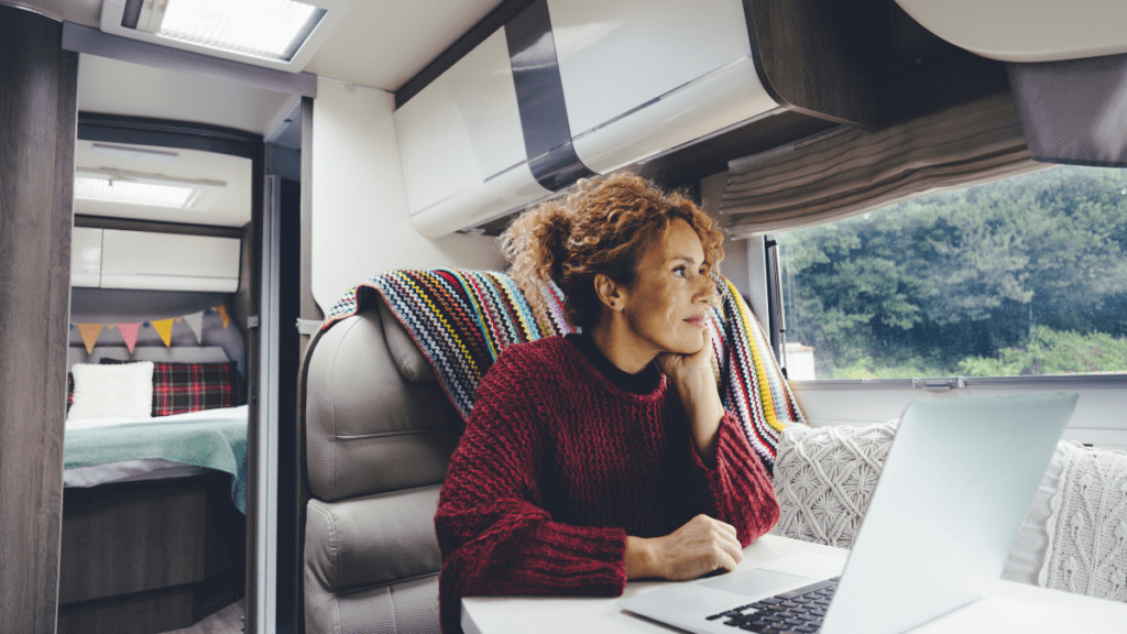 a lady reading and relaxing inside the camper van
